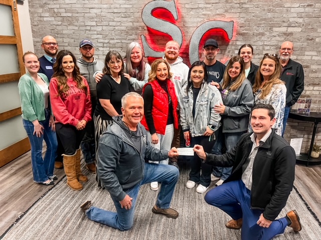 BRN Members BRN Group of members pose in front of South Central Industries signage.