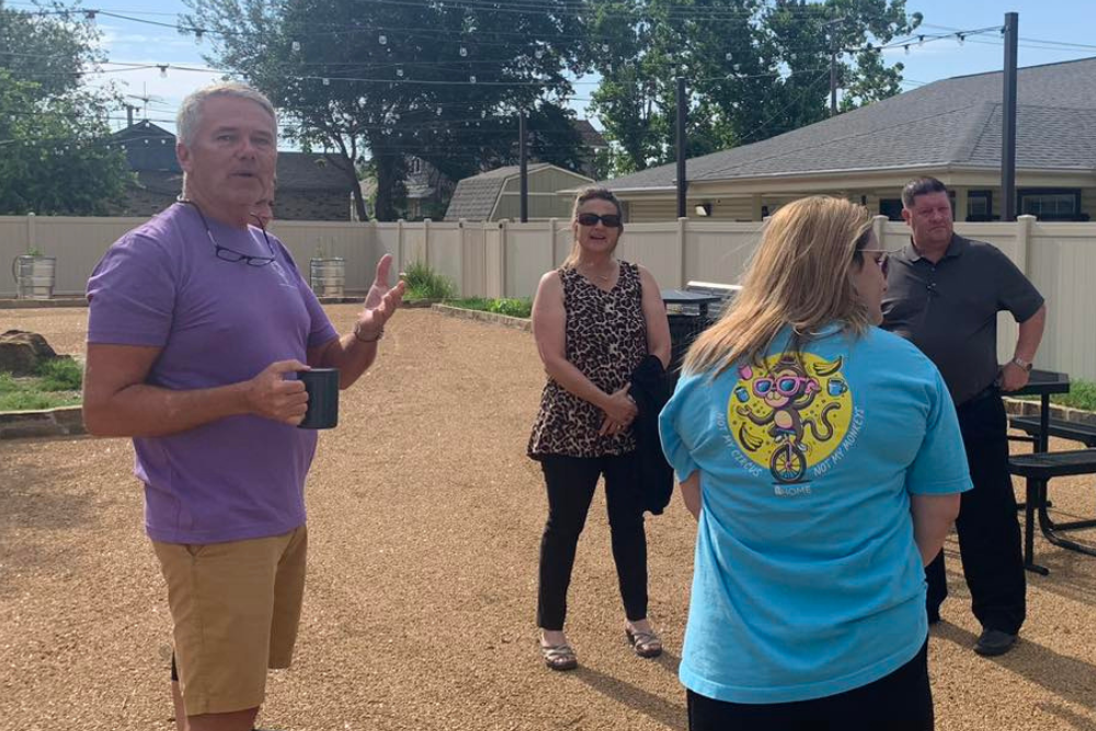 Jimmy Jimmy, Crystal, Todd, and another person standing outside visiting.