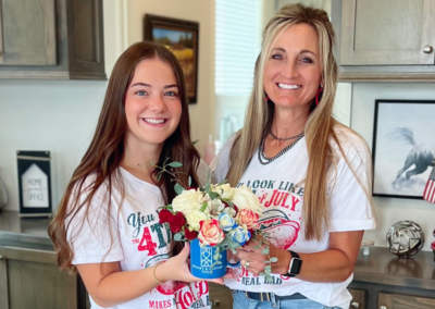 Amy Moon and assistant Patton pose with a cup of flowers from Stuart & Clover.
