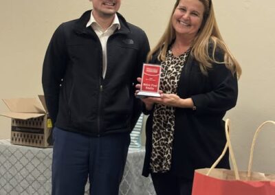 Crystal Wagoner receives an award.