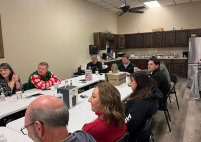 Group of BRN members sit around the table having fun.